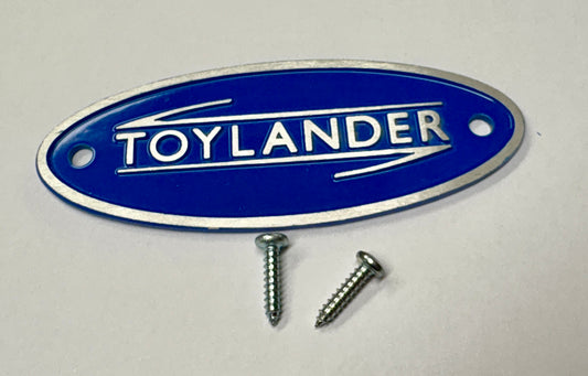 Toylander Badge